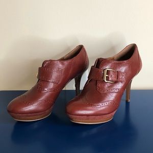 Nine West, size 7. Mahogany brown, saddle shoe, heeled bootie.